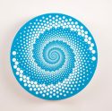 Large spinning magnet with illusion effect
